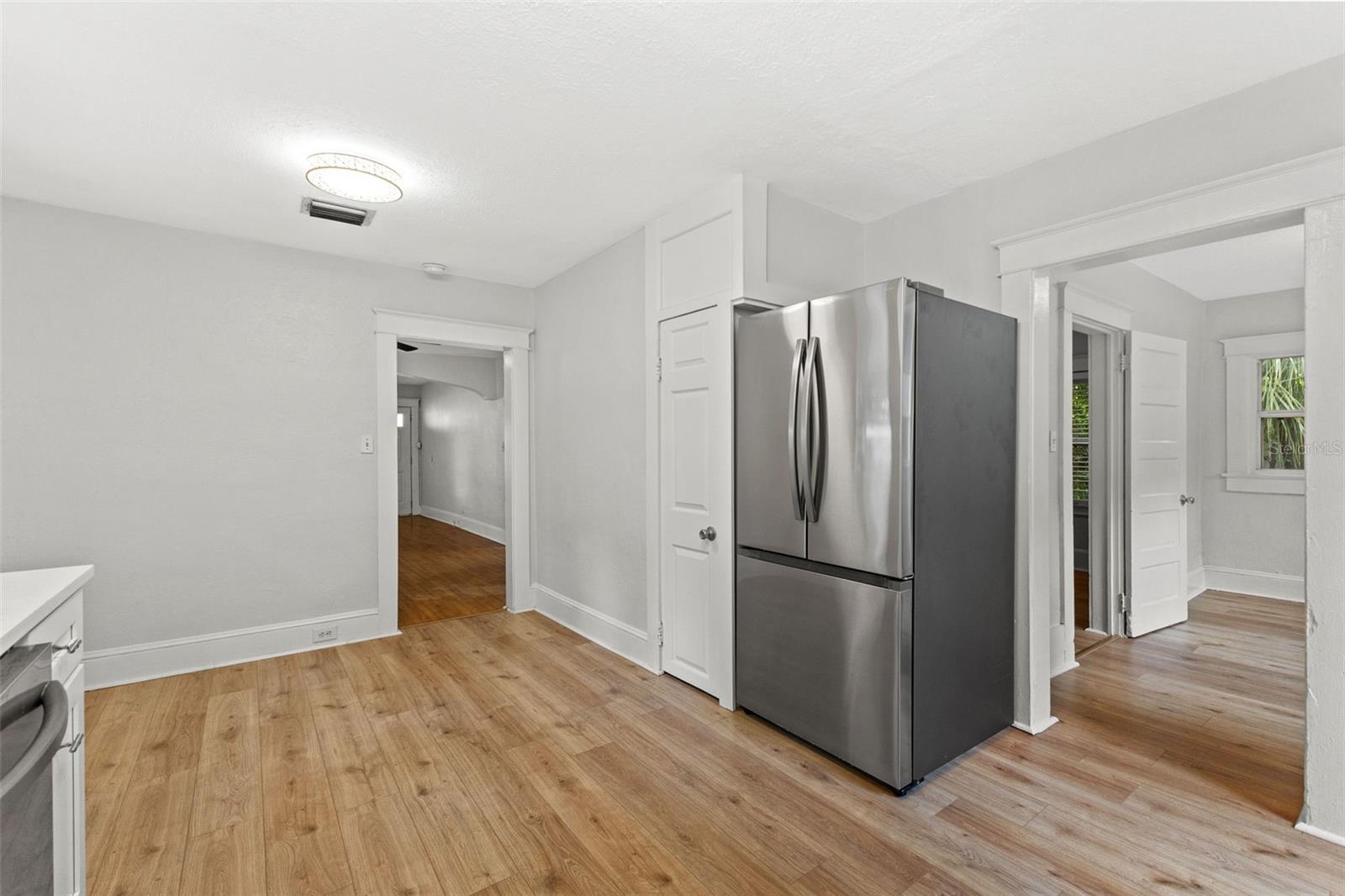 Kitchen leading to laundry room and dining room