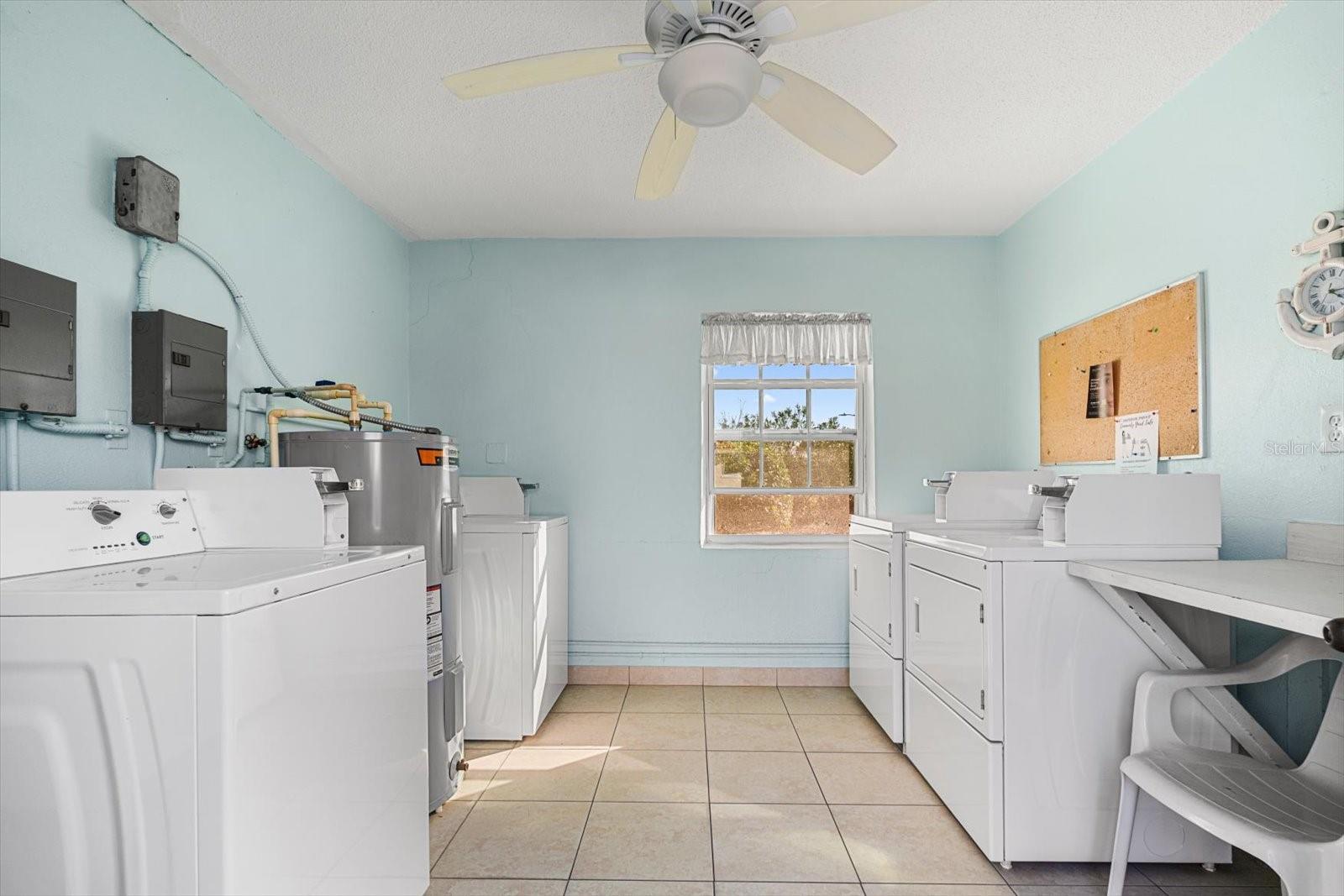 Common area laundry room in resident building.