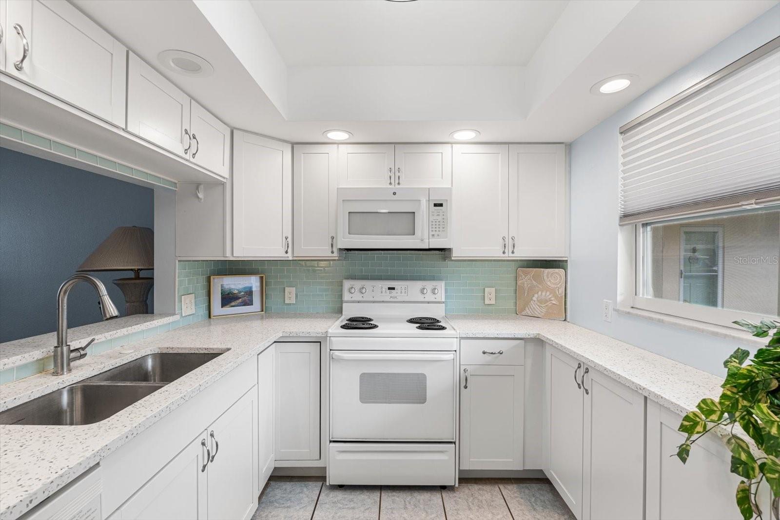 Abundant counter and cabinet spaces is offered.