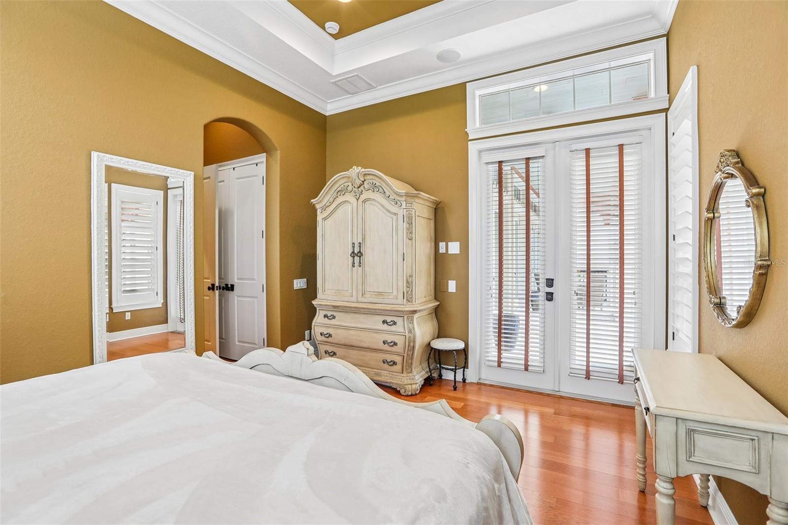 1st Floor Guest bedroom with en-suite bath and French doors to the pool.