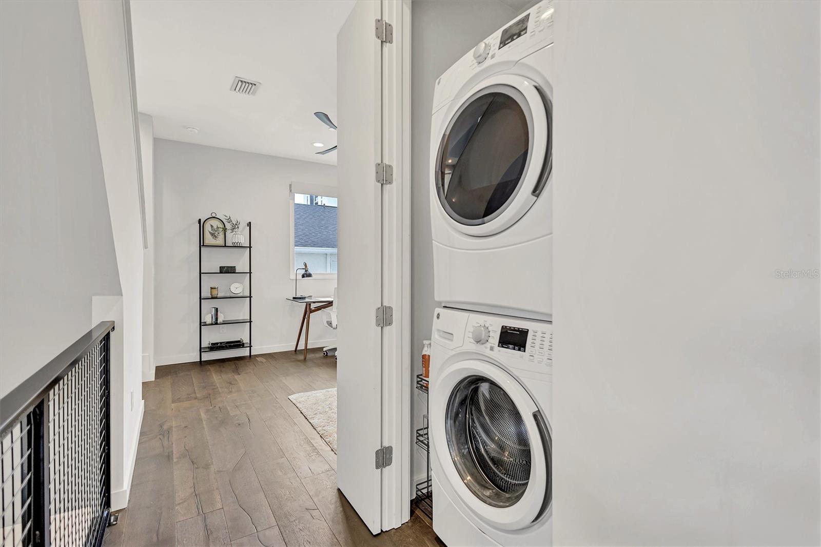 Washer/Dryer closet at top of stairs.