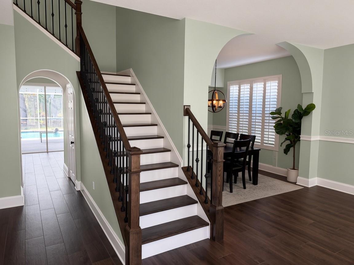 Stair case/dining room as you enter Stair case/dining room as you enter