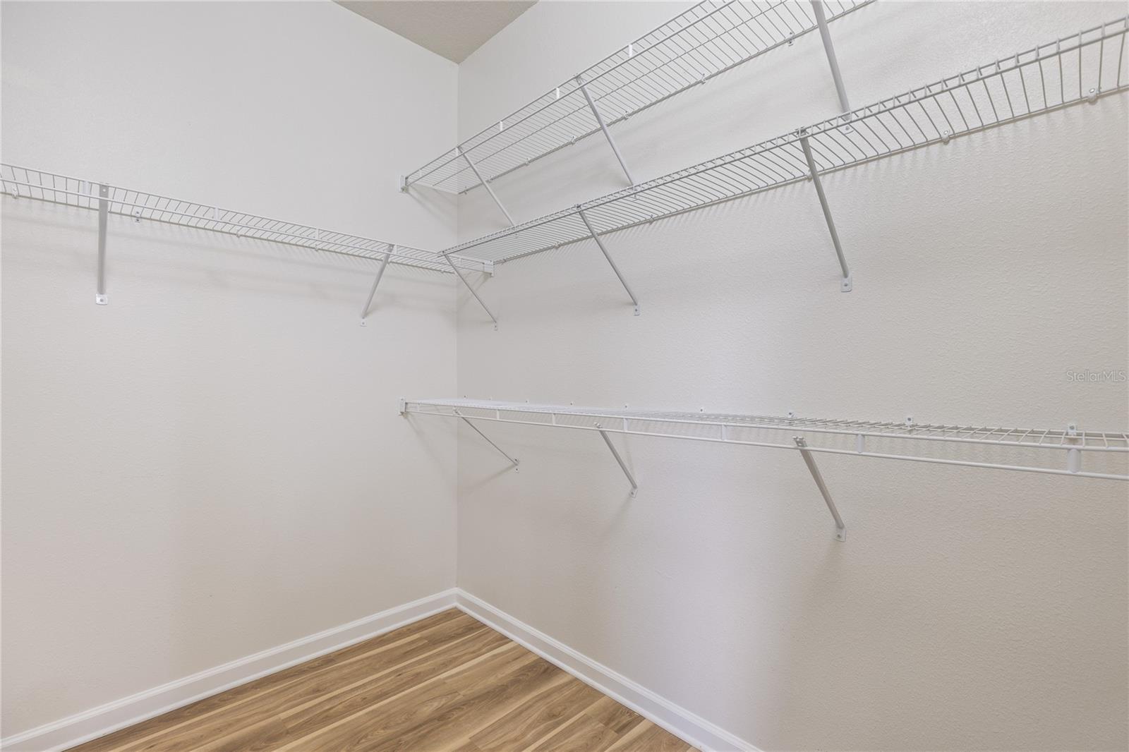 Primary bedroom walk in closet 2 in bathroom