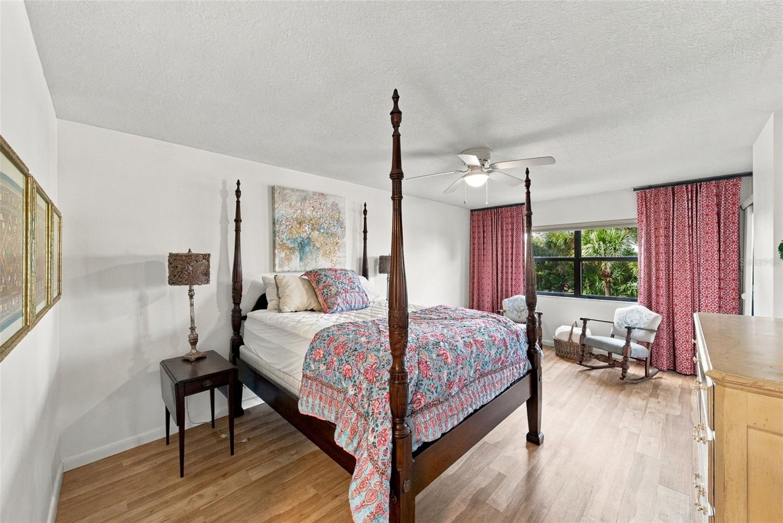Primary En-Suite Bedroom with balcony access and nature views