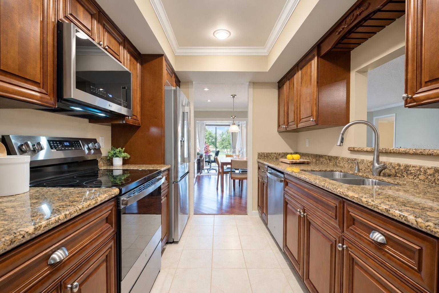 Gorgeous solid wood cabinetry, granite countertops, and recessed lighting~