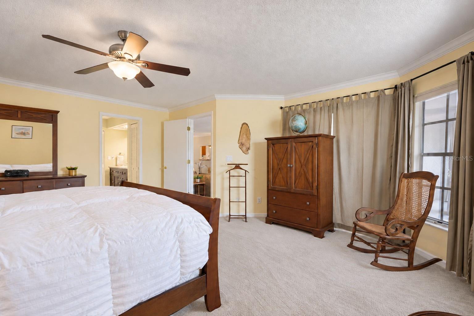 Primary hall leads to his & hers walk-in closets and updated en-suite~
