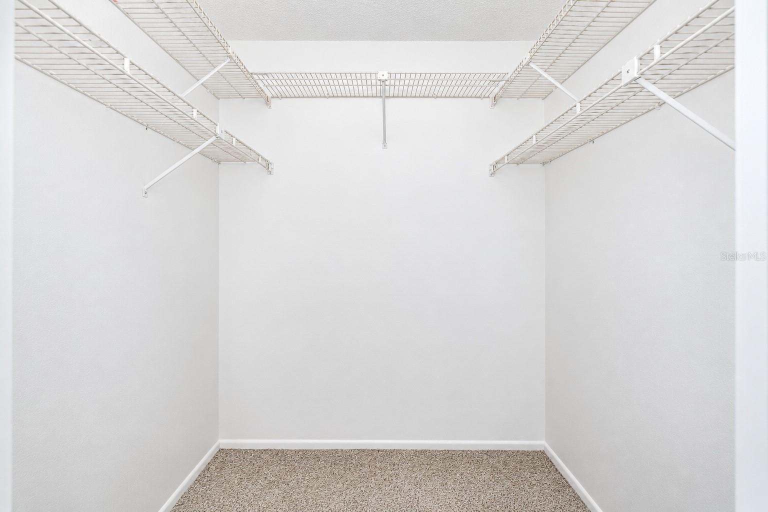 Primary walk-in closet.
