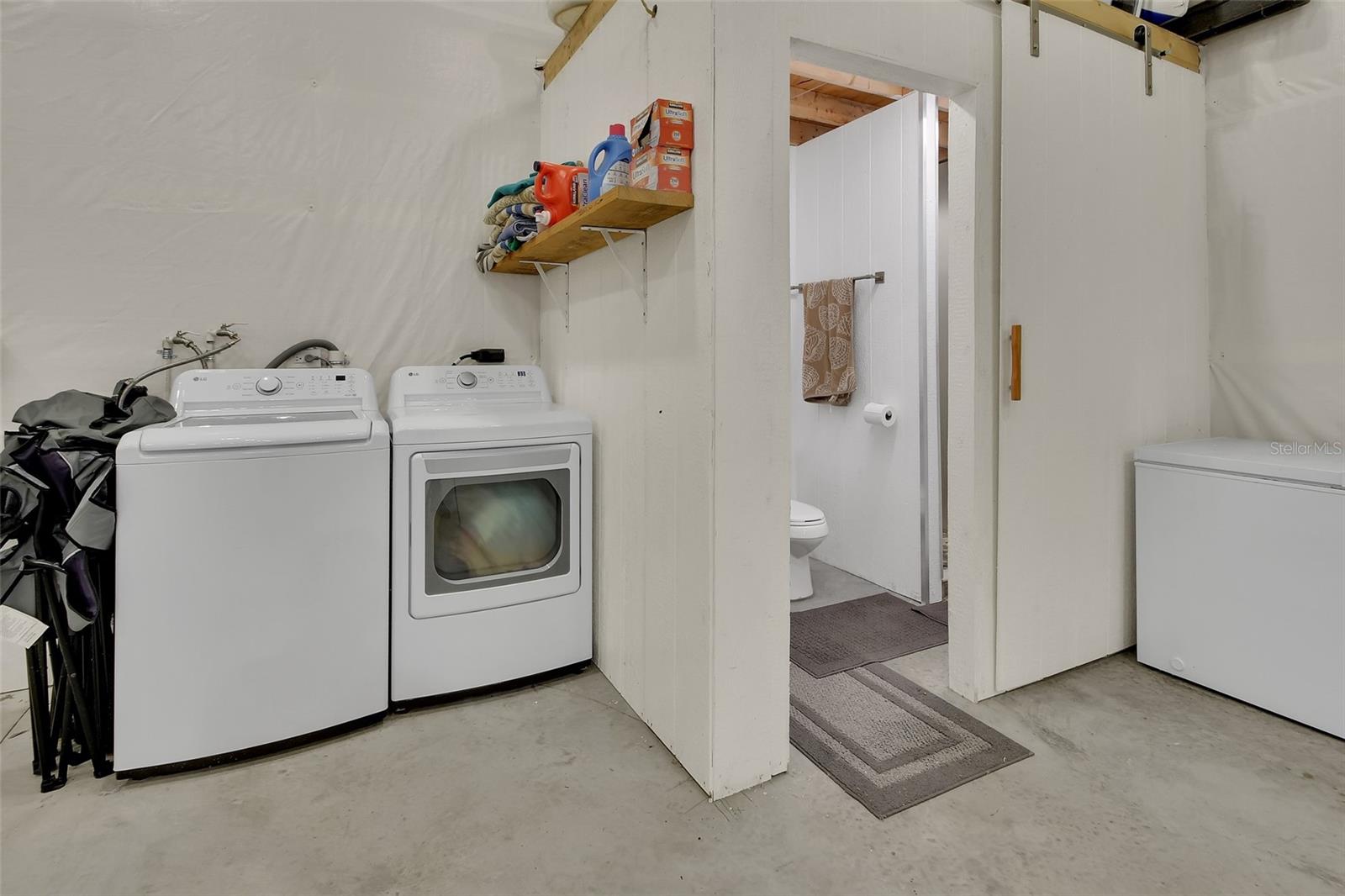 Laundry area inside outbuilding
