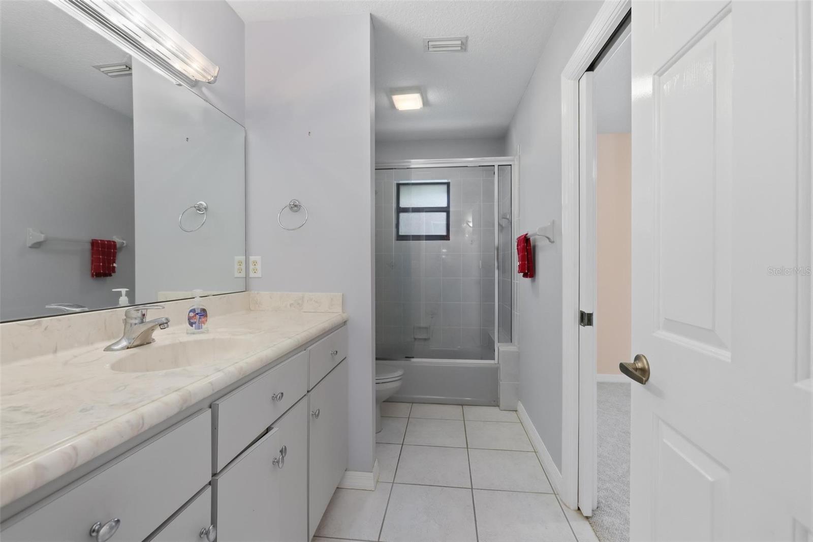 Bathroom #2 (hall).  Additional entrance on right into bedroom #2.