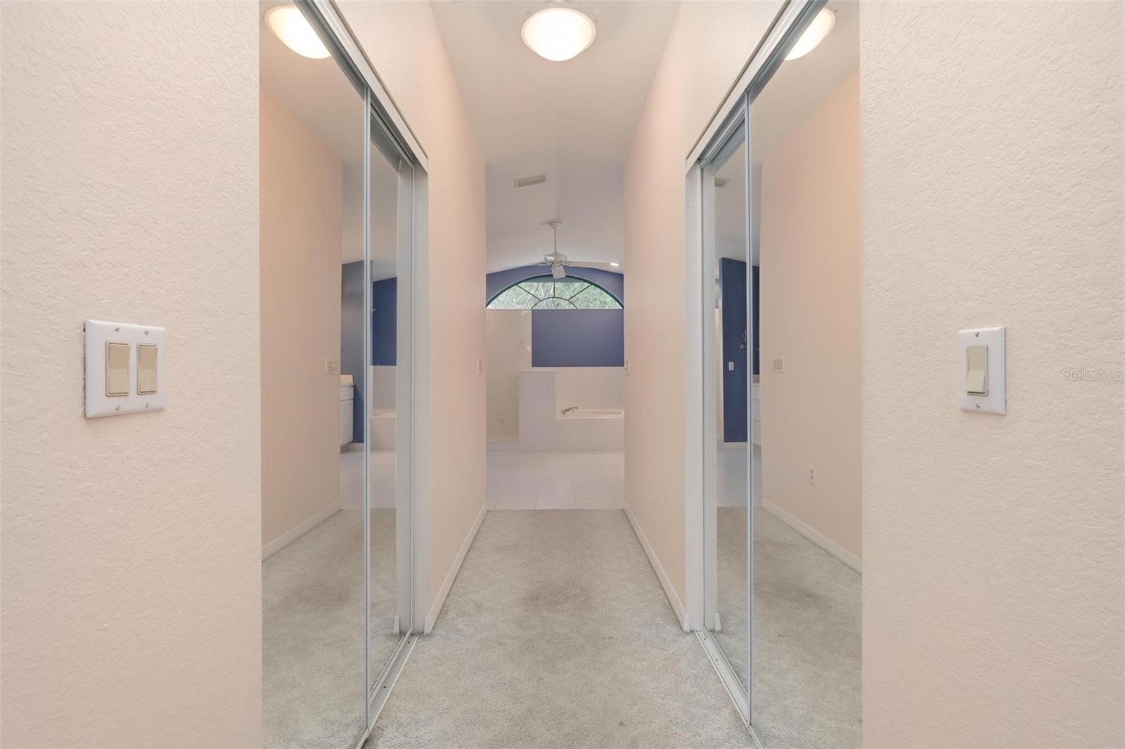 Two walk-in closets in primary bedroom.