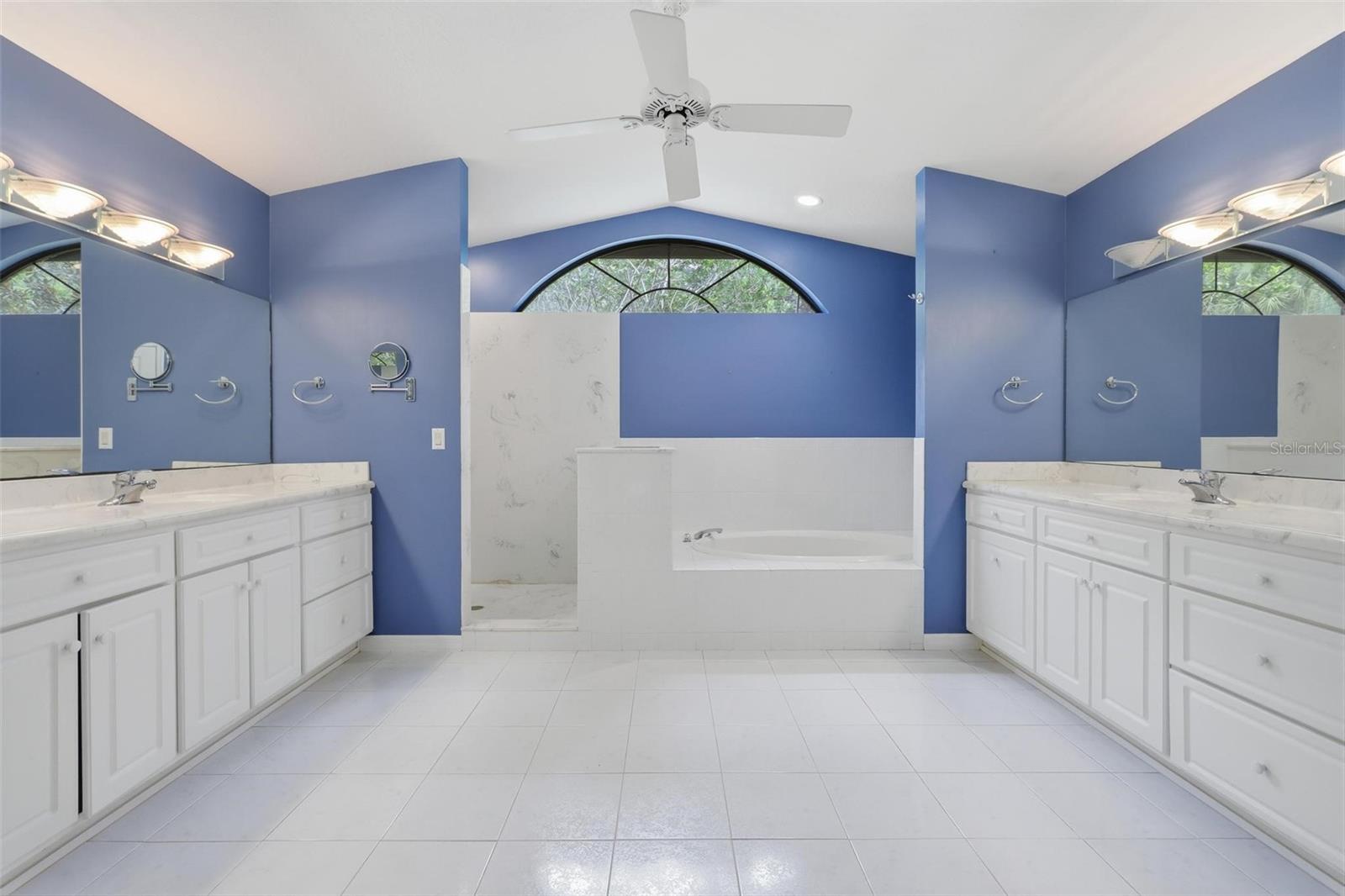 Huge primary bath. Two separate sink/vanities, walk-in shower, large garden tube.