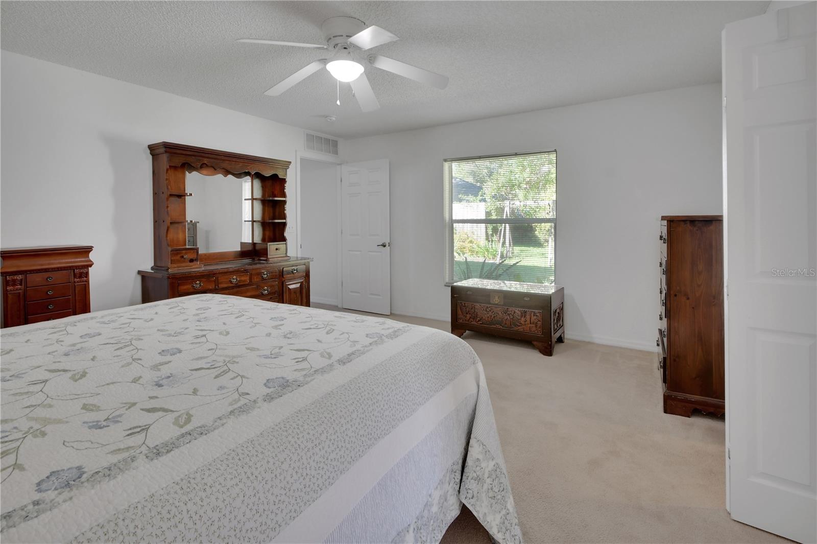 Primary Bedroom has ample space for a sitting area near the window