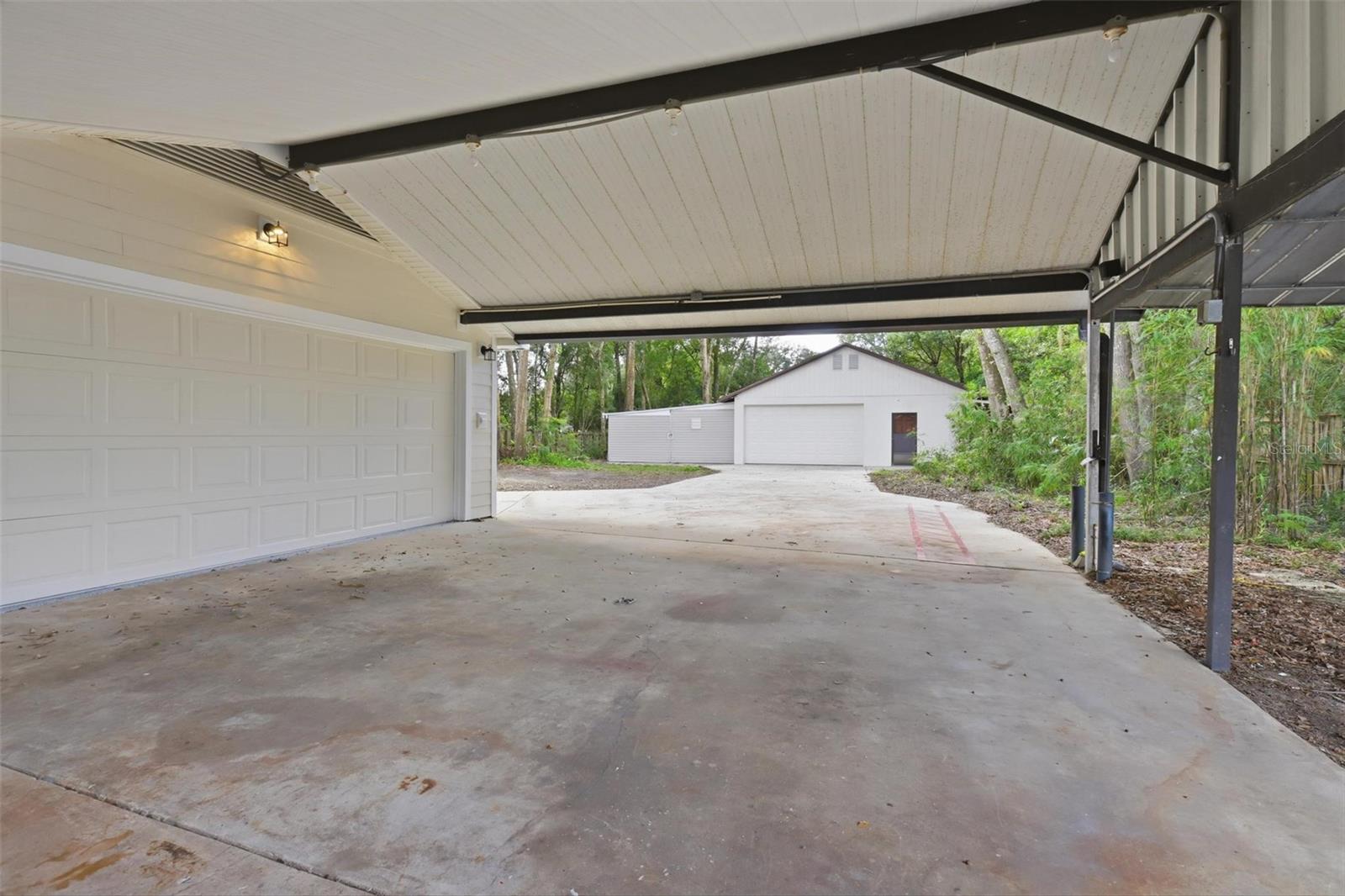 Carport leading into Detached Garage No 1