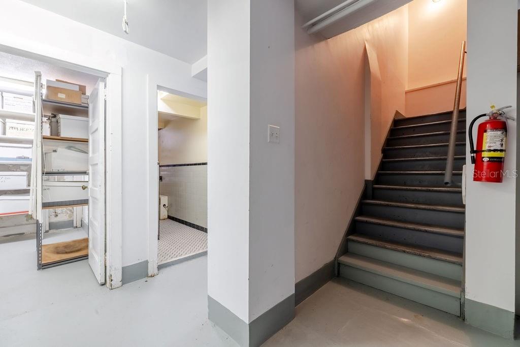 Interior basement stairs leading to the first floor.