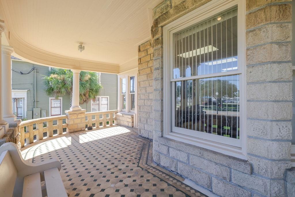 Oversized historic windows on the front porch.