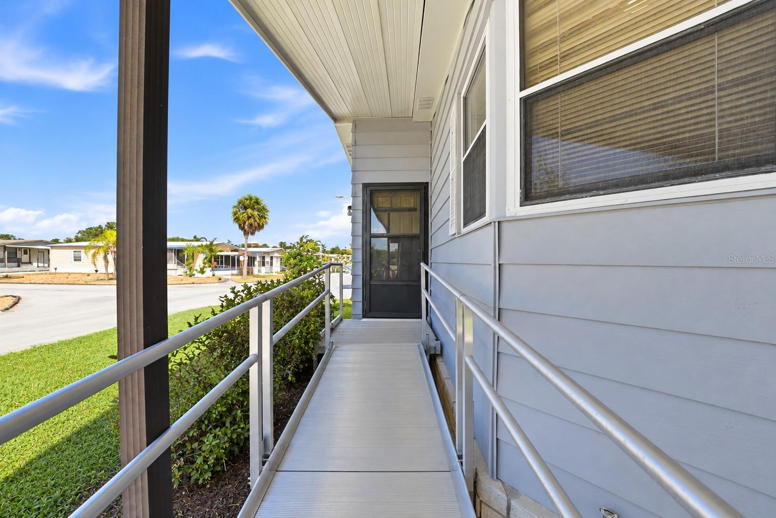 Front door entrance via aluminum ramp
