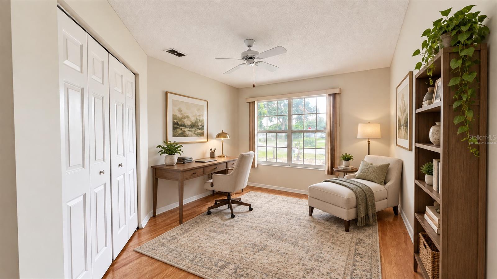 1 of 3 total bedrooms, this one features double door entry. Virtually staged as a home office/library.