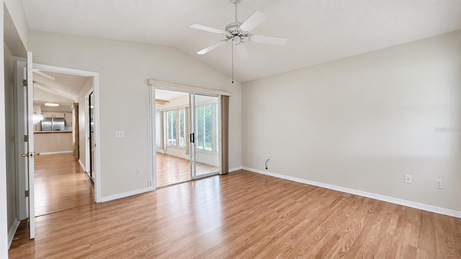 Master bedroom facing the side and lanai features large WIC and bath.