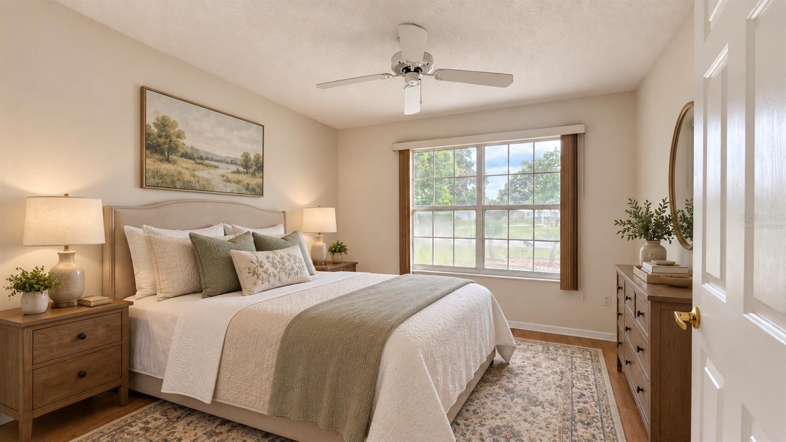 2 of 3 total bedrooms. Virtually staged as a guest bedroom here.