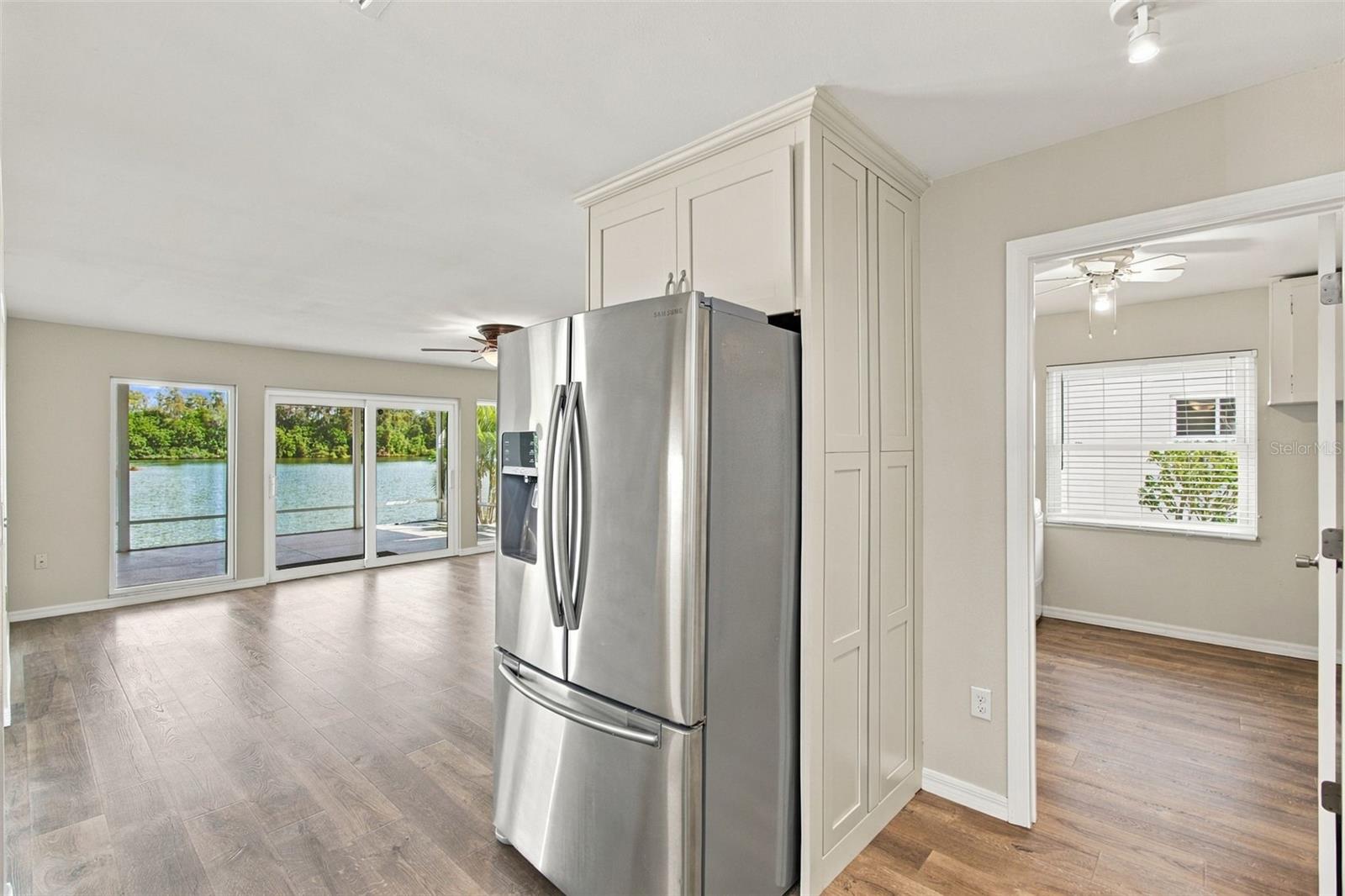 Dining room and looking into laundry room from kitchen