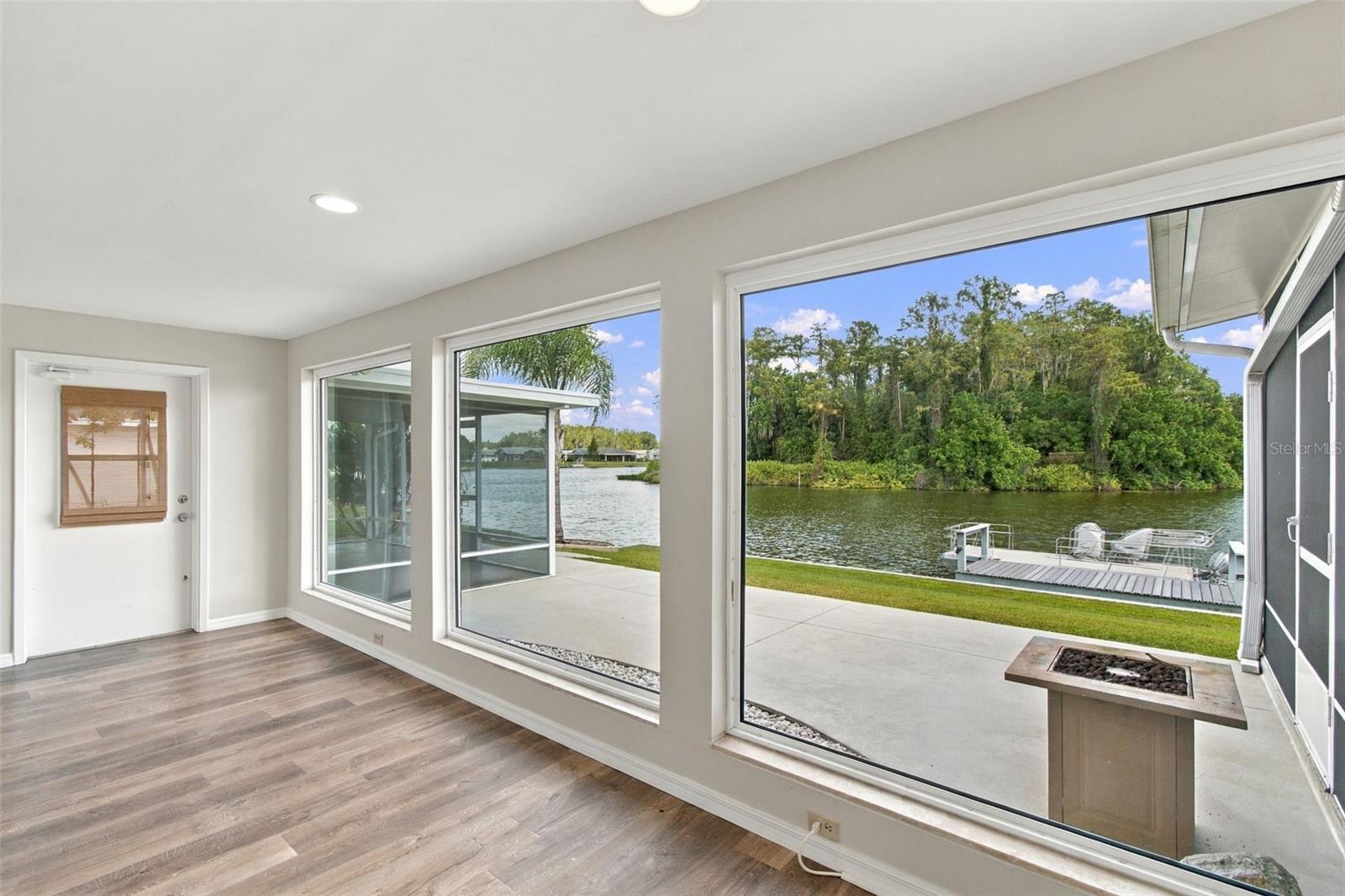 FAMILY ROOM VIEW, Back patio, screened porch on each side.