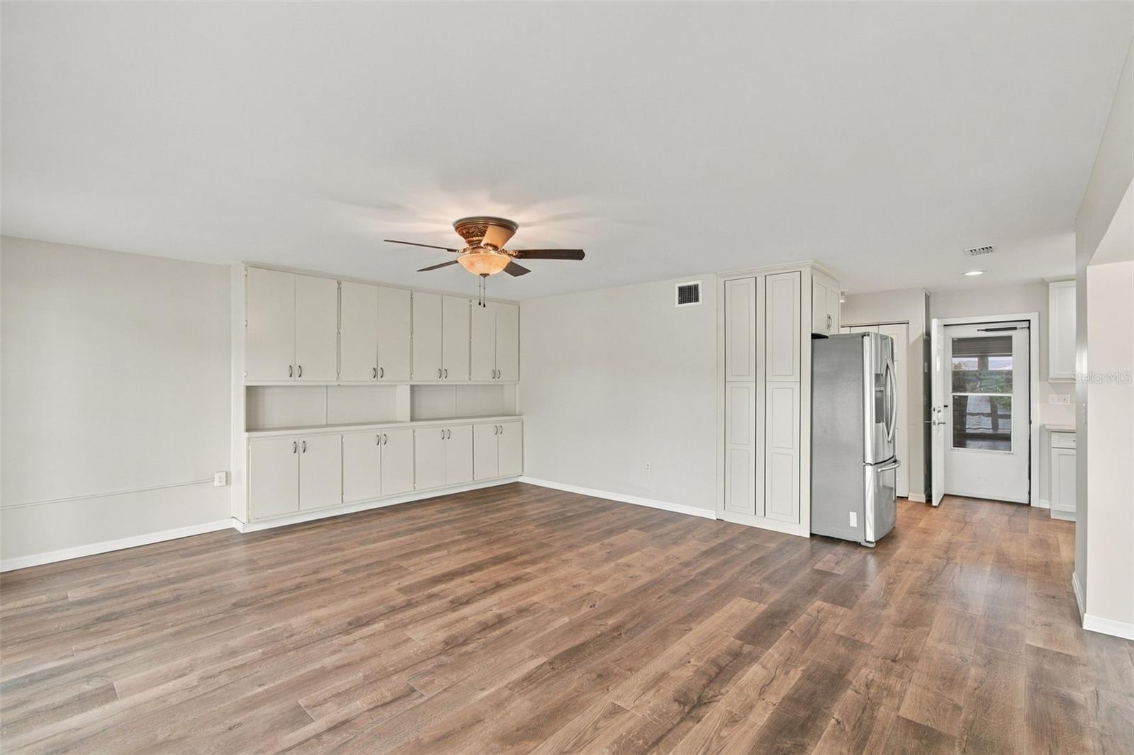 Dining room showing built-ins and door to garage