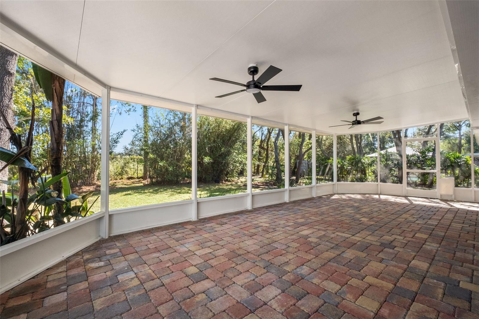 Expansive Screened Rear Porch with Pavers Expansive Screened Rear Porch with Pavers