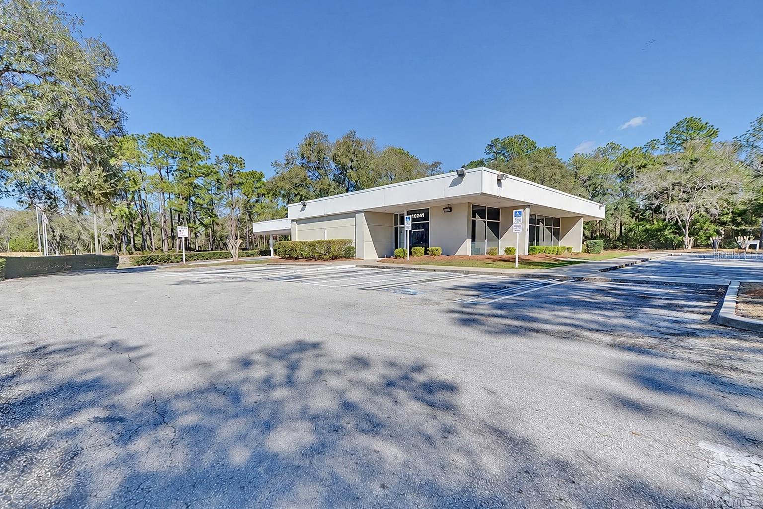 Freestanding 3,280 SF building with paved on-site parking. Digitally edited to remove former bank signage.