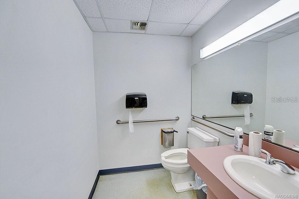 Second restroom with existing fixtures.