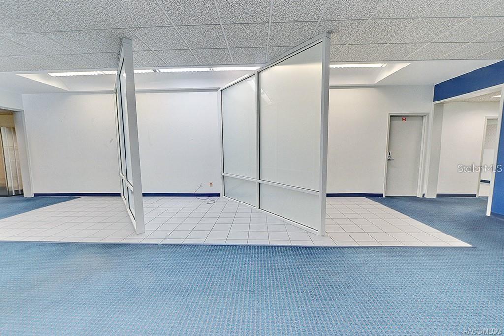 Interior view showing the open area and existing office partitions. Interior view showing the open area and existing office partitions.