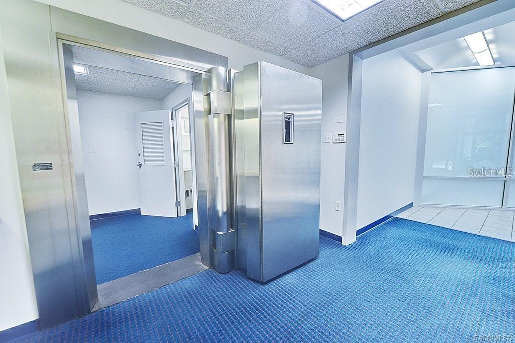 Existing vault entrance and adjoining interior space.