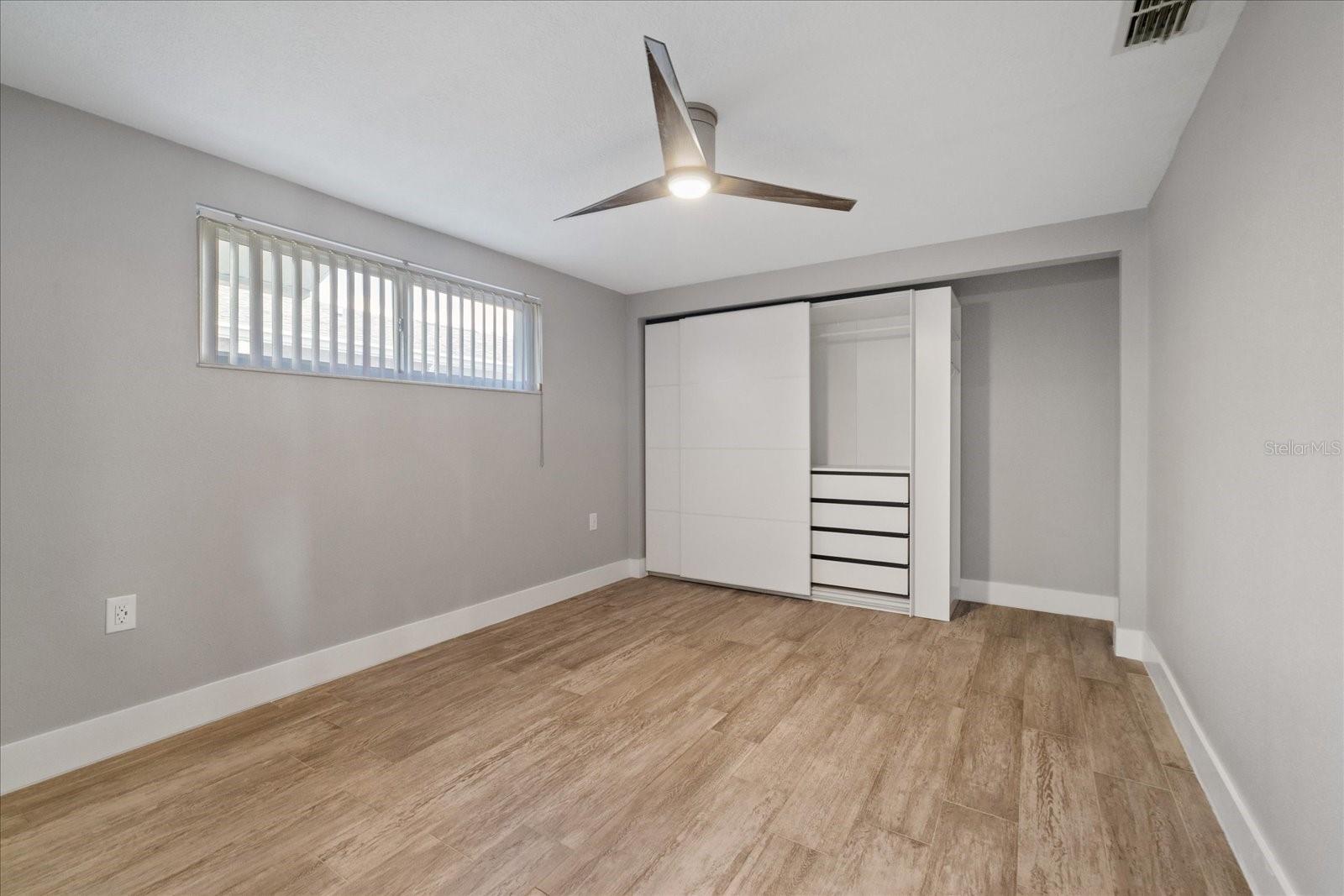 2nd bedroom showing closet unit