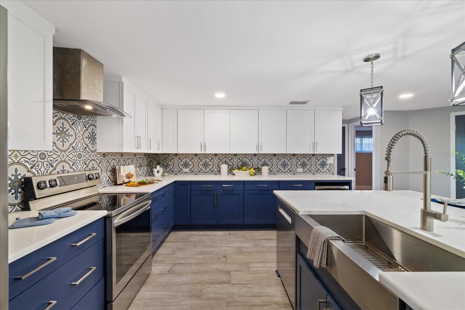 Functional high-end kitchen with island sink and bar