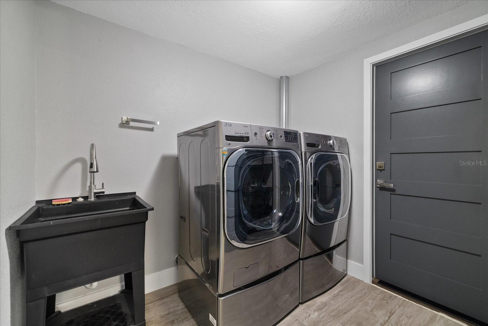 Climate controlled laundry room with sink