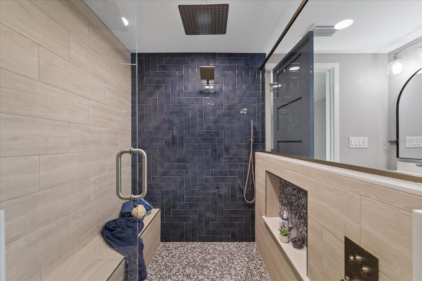 Large walk in glass shower in primar