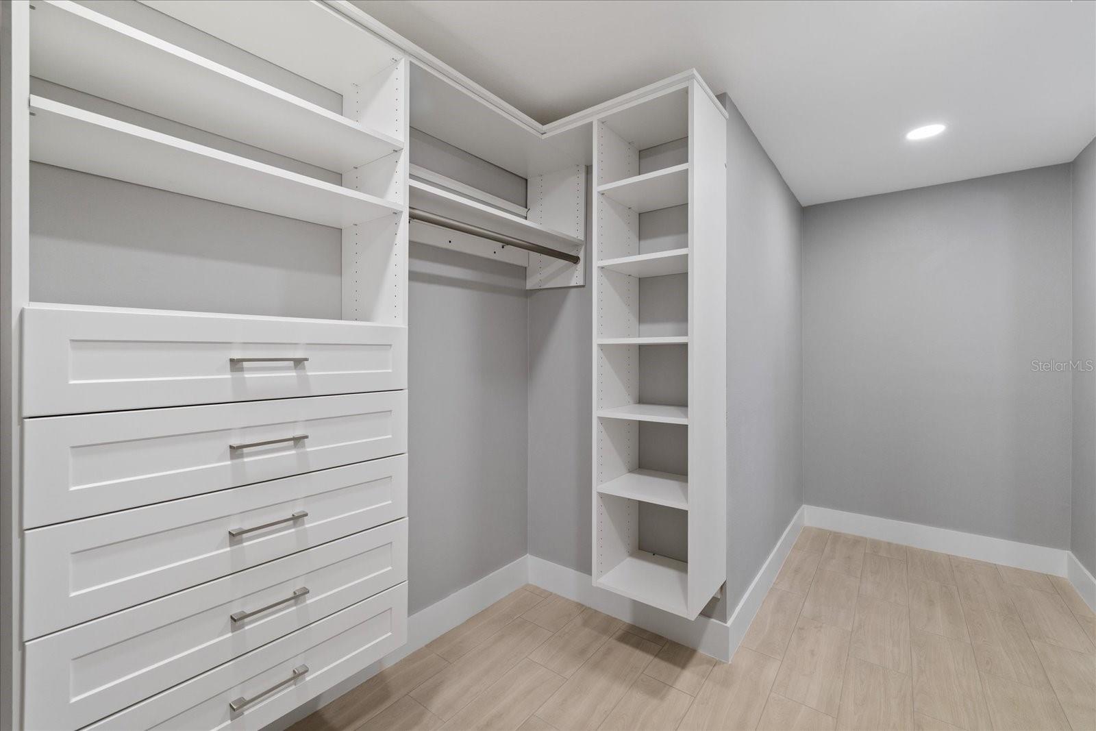 Walk in custom closet in primary