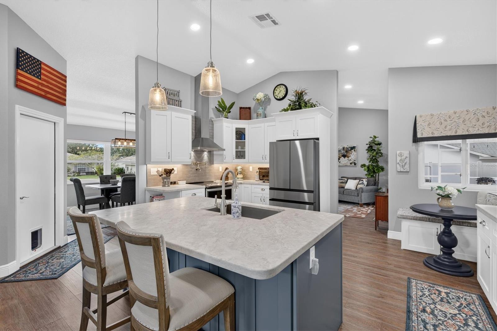 Two tone cabinetry with contrasting Island