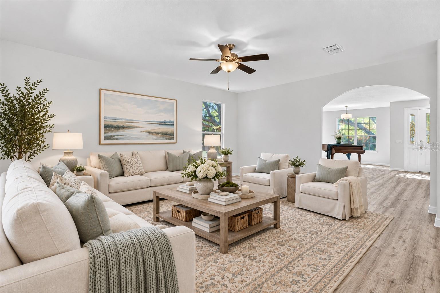 The family room facing the backyard and adjacent to the kitchen. Virtually staged to help you envision your future here.