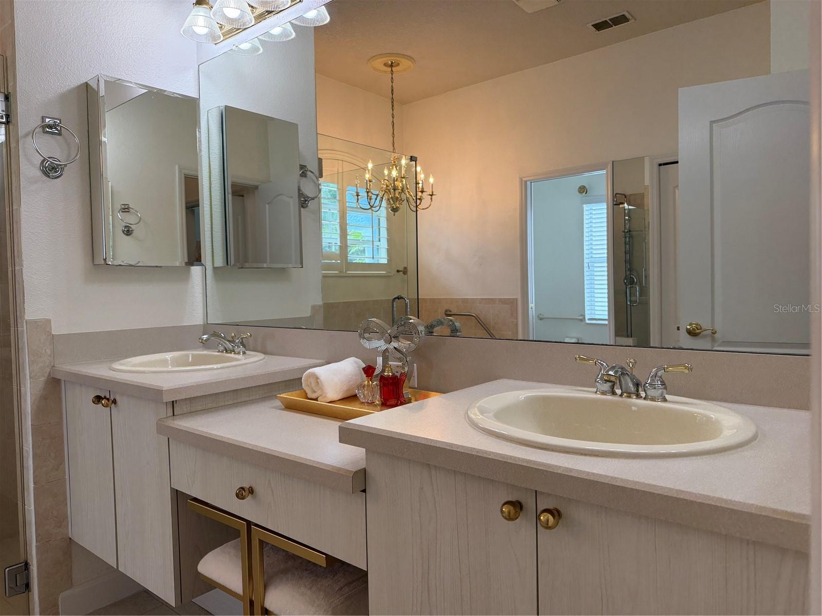 There are two medicine cabinets one on each side of sinks