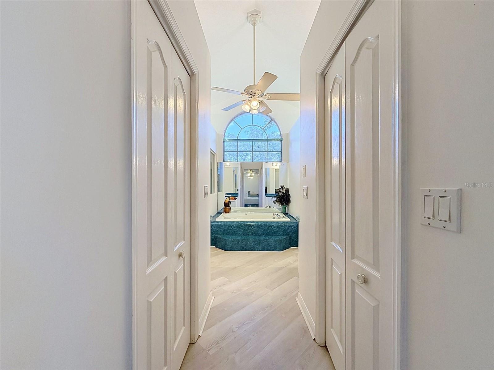 Owner's suite includes jetted tub, two WICs, linen closet, water closet, two vanities, and large shower.