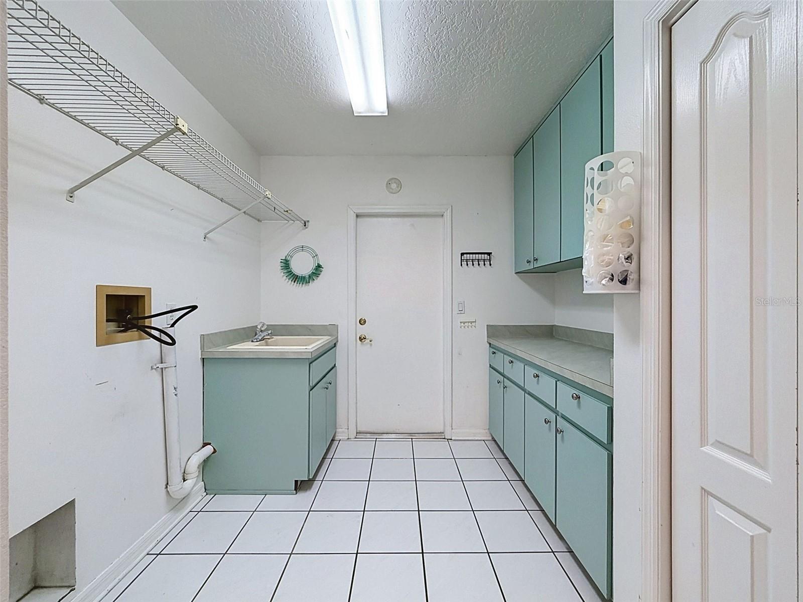 Laundry room has storage gallore!