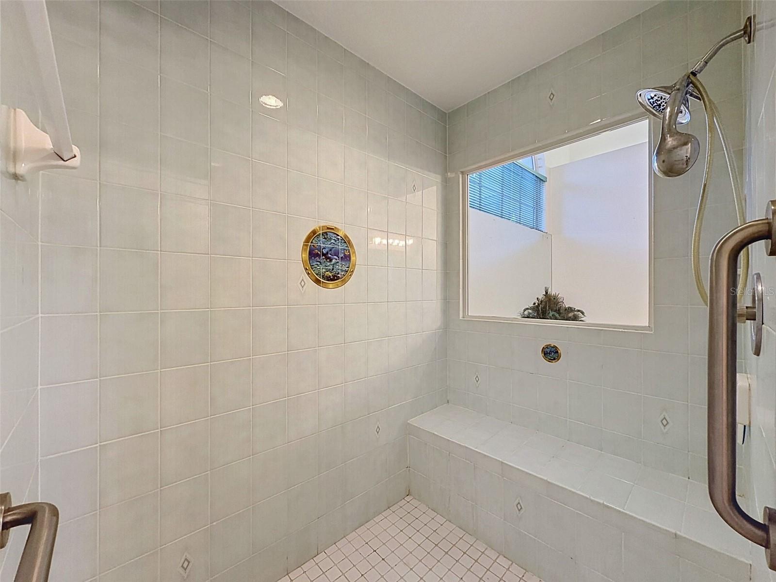 Owner's suite includes jetted tub, two WICs, linen closet, water closet, two vanities, and large shower.