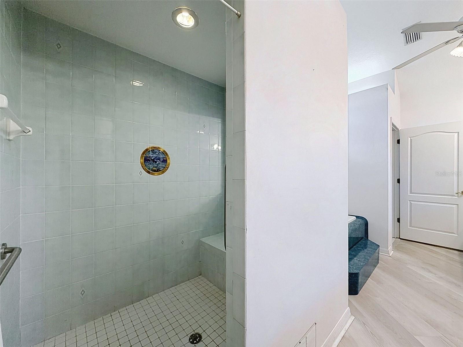 Owner's suite includes jetted tub, two WICs, linen closet, water closet, two vanities, and large shower.