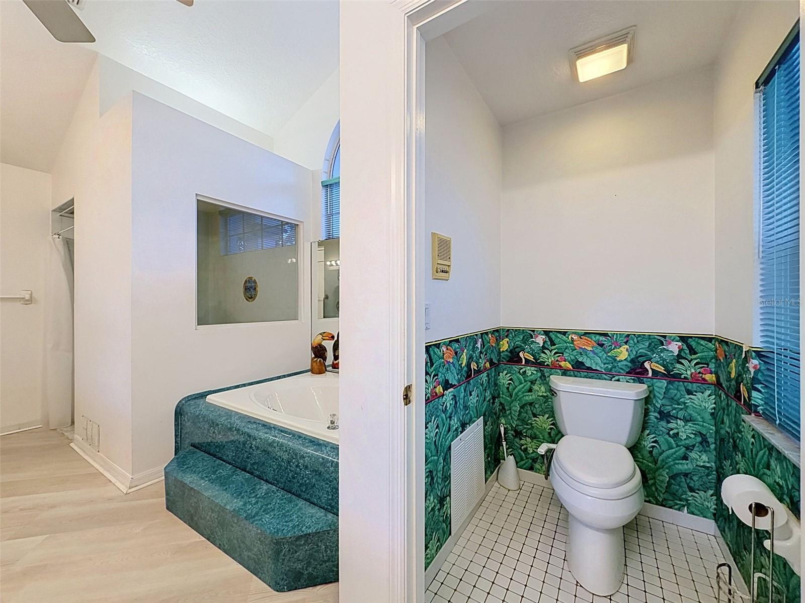 Owner's suite includes jetted tub, two WICs, linen closet, water closet, two vanities, and large shower.