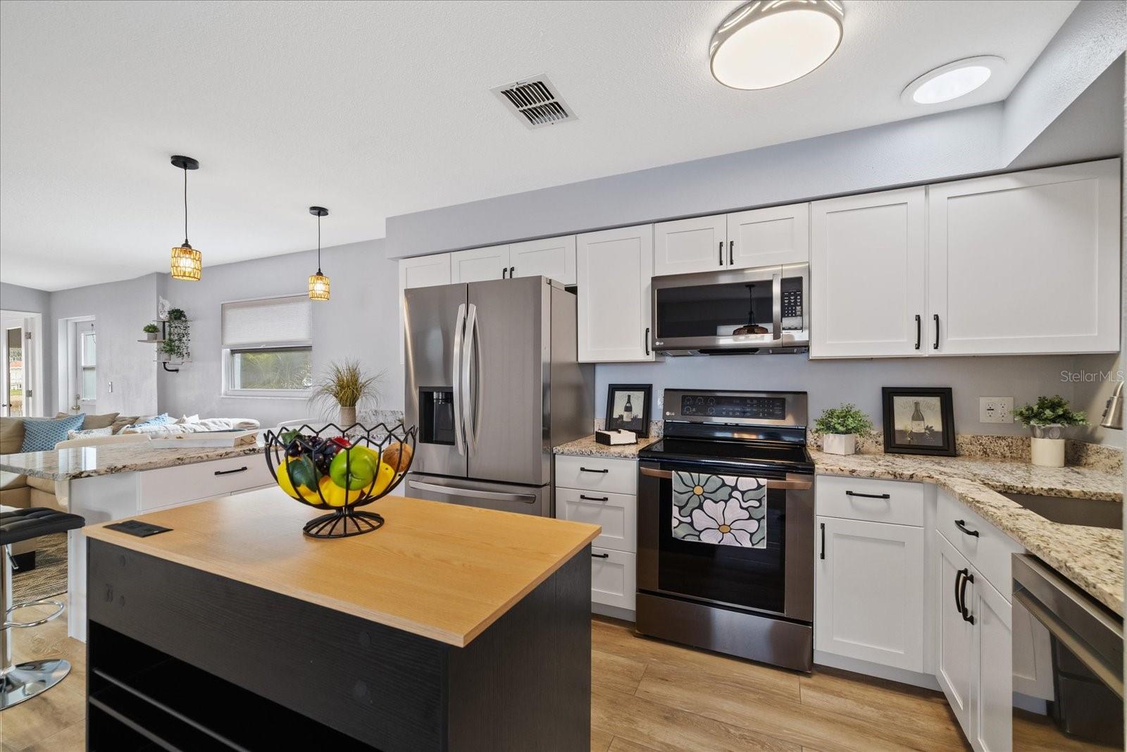Completely updated kitchen with moveable island for added storage and counter space