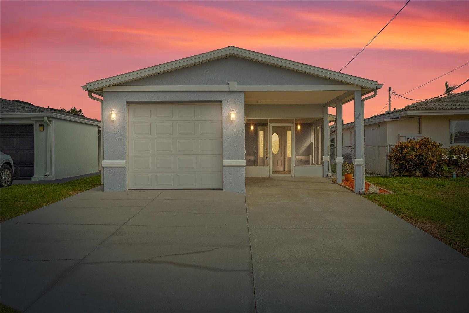 Virtually enhanced twilight front view of home. Virtually enhanced twilight front view of home.