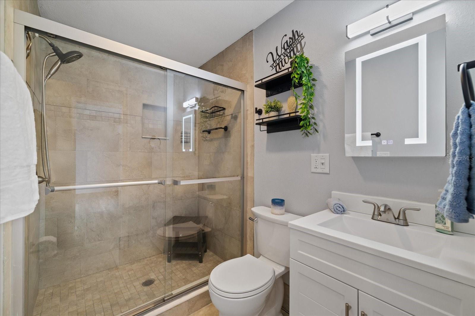 Updated bathroom 2 with walk in shower and LED mirror/vanity cabinet