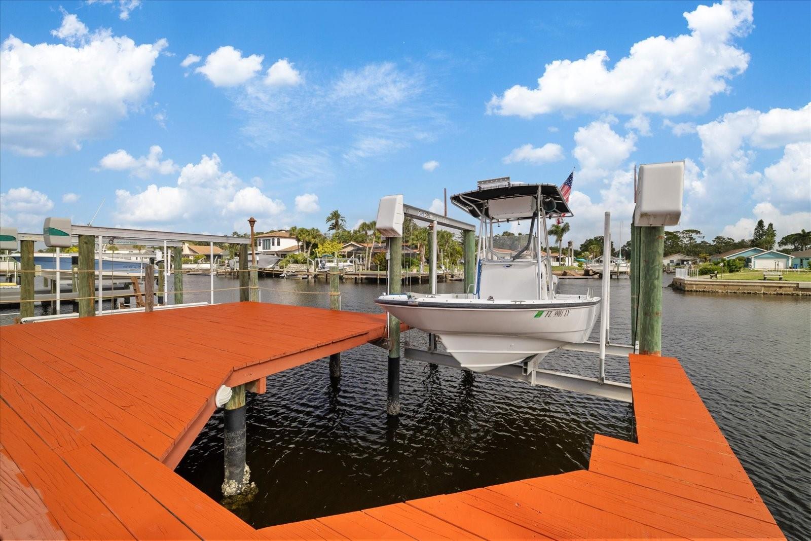 10,000 boat lift and surrounding  deck built over seawall.