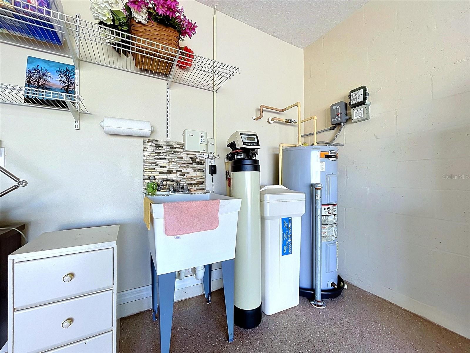 Owned water softener by laundry sink