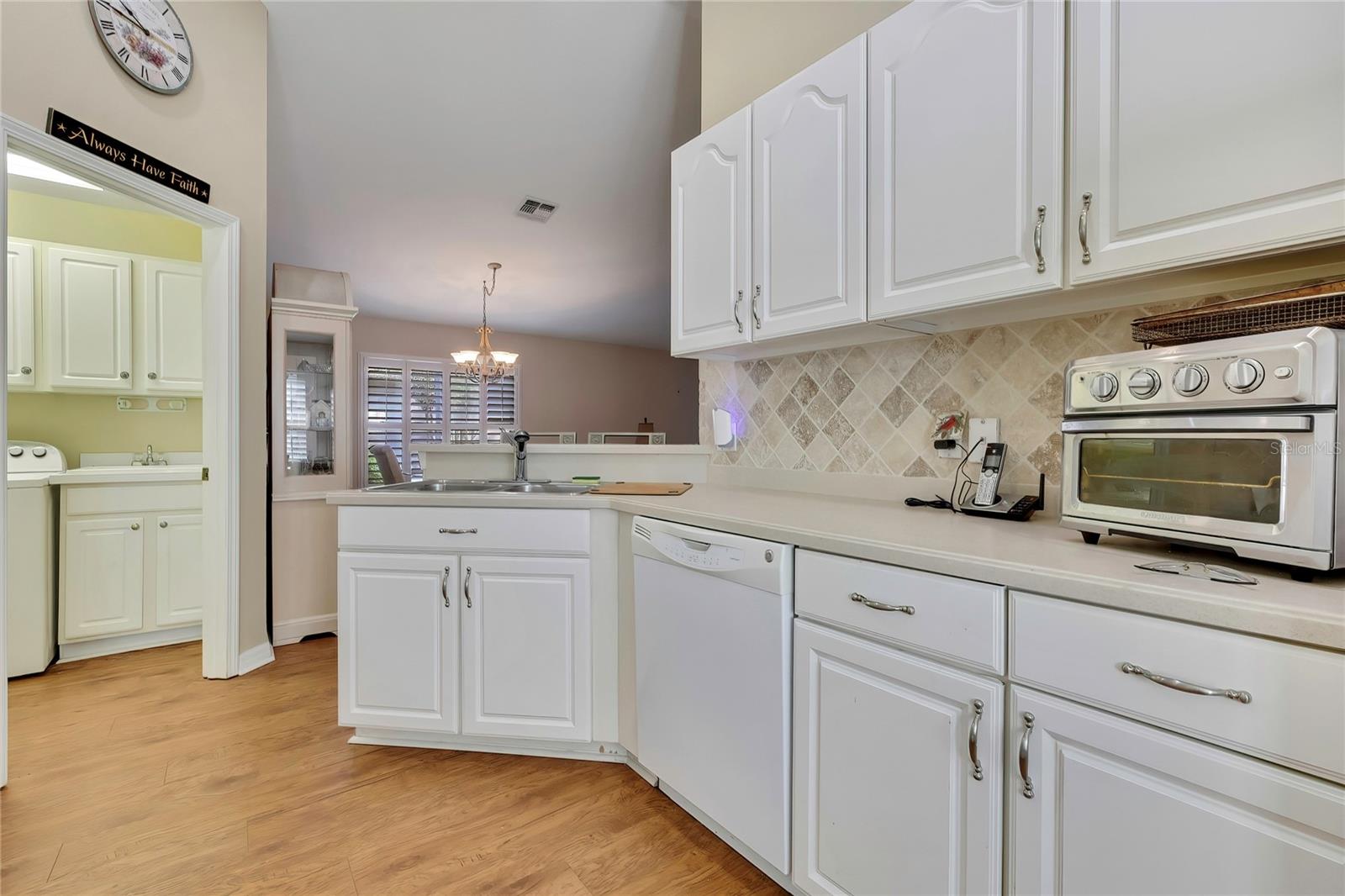 Wood and Glass Cabinets, Corian Counters